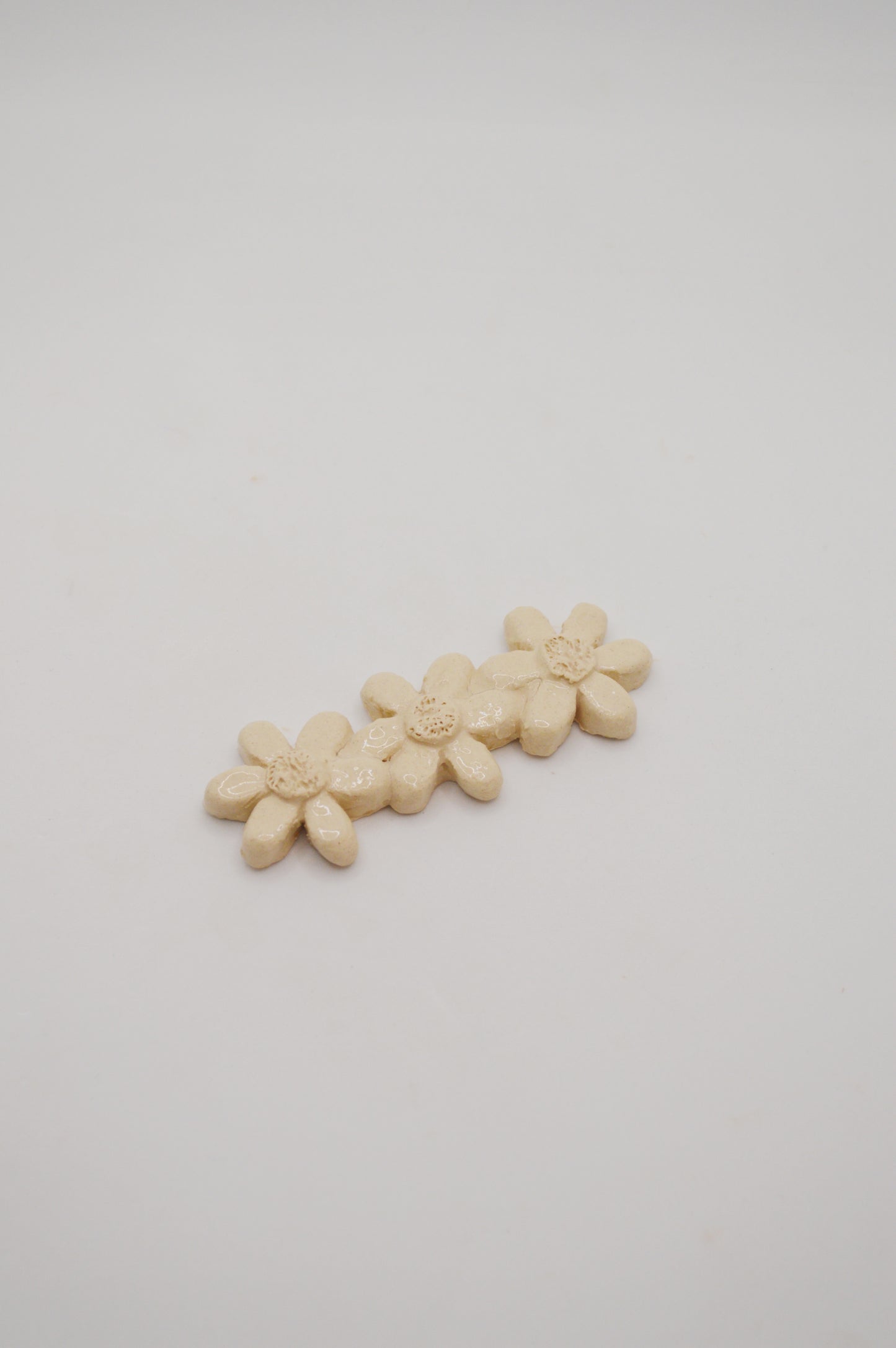 Porte-couteaux grandes fleurs crème